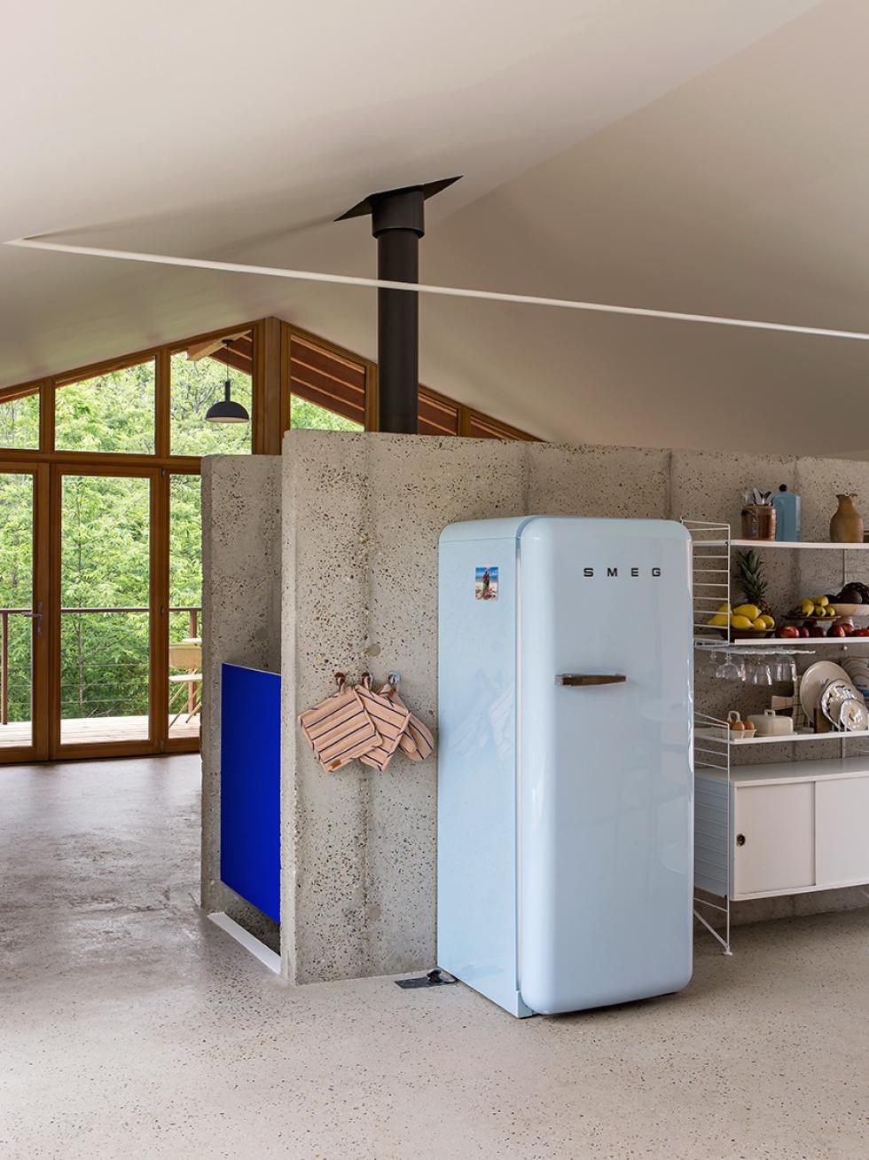 Waxed concrete and a baby blue Smeg fridge