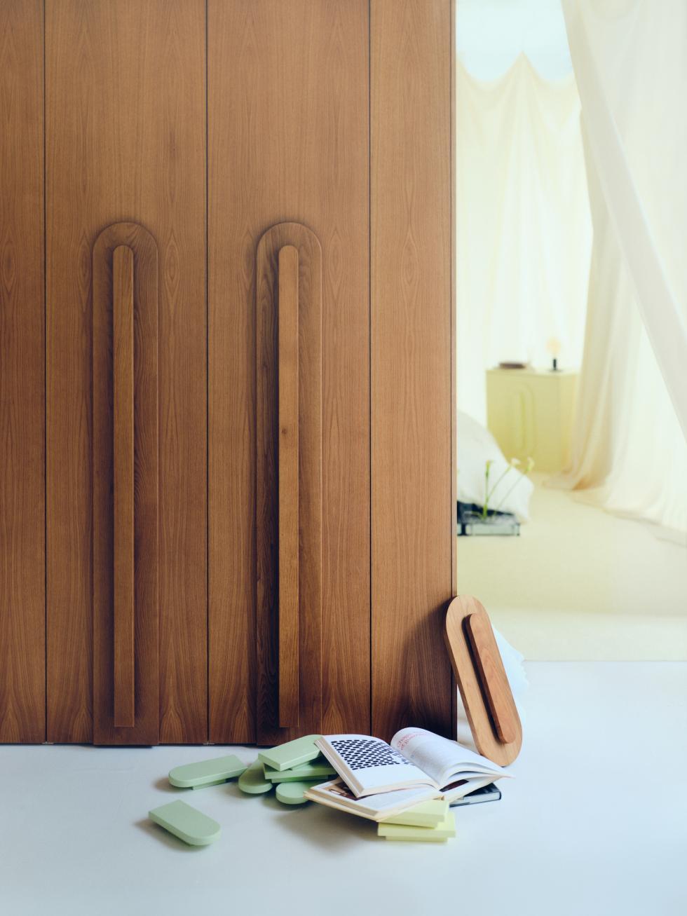 Honey oak wardrobe with Pilule handles by Pauline Borgia